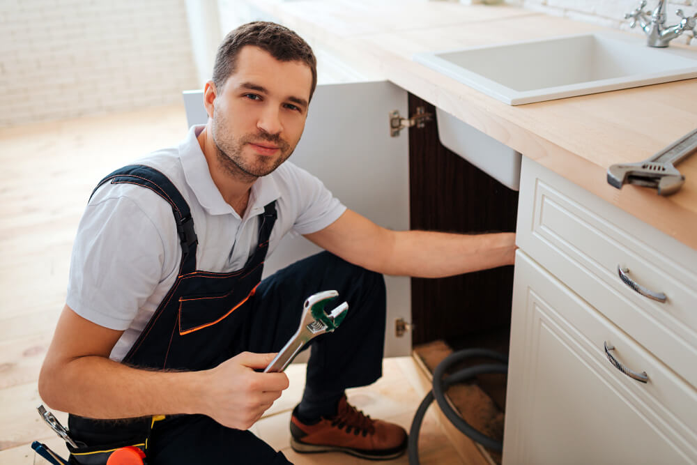 TrustFlow licensed plumber inspecting residential plumbing system in Grimsby, Ontario